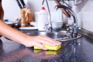 Cleaning-kitchen-with-sponge-300x200.jpg