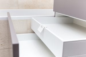 A-cabinet-with-opened-drawers-and-inner-drawer-in-a-bathroom-300x200.jpg